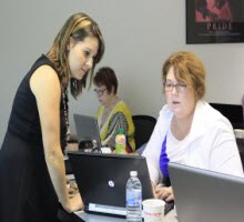 Jenny Munn checking out an attendee's work during an SEO bootcamp in Atlanta